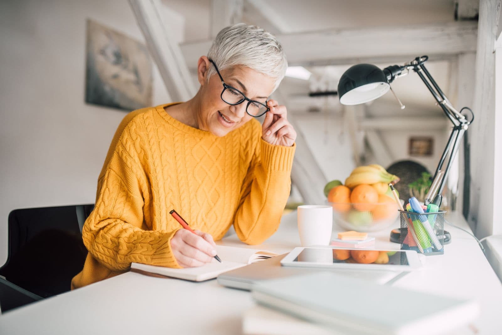 Modern menopausal aged woman writing