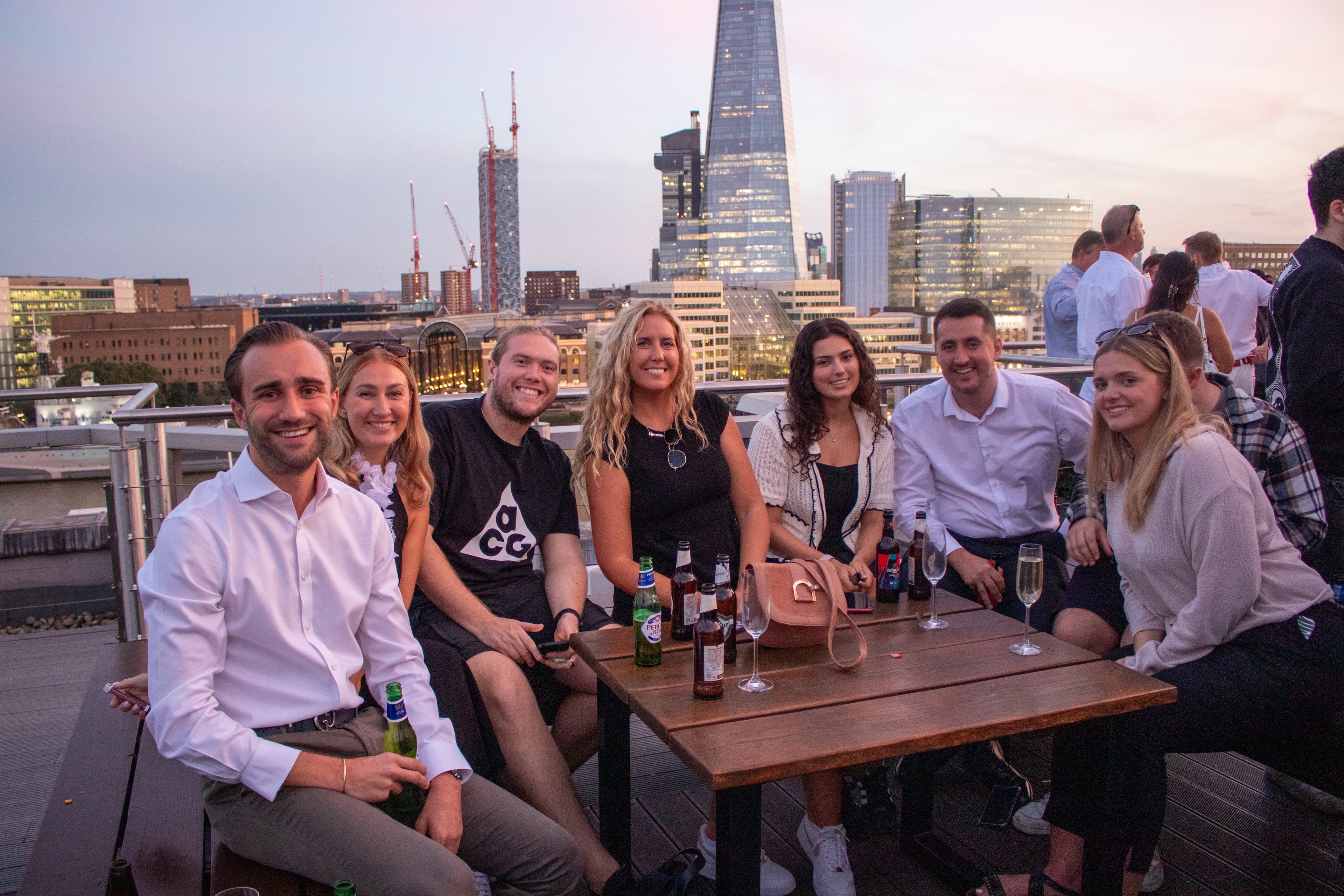 Group socialising on Rooftop bar in Monument